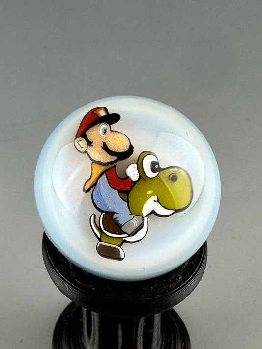 White & green M riding Yosh marble